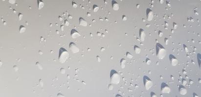 Water droplets perspective through white color surface photo