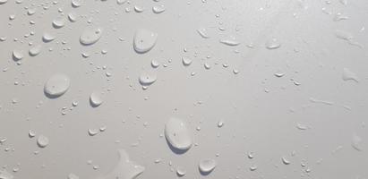 Water droplets perspective through white color surface photo