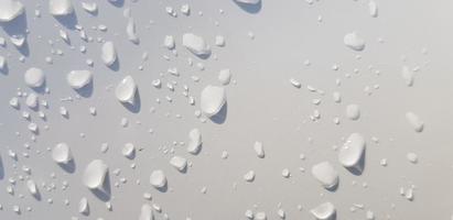 Water droplets perspective through white color surface photo