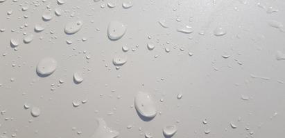 Water droplets perspective through white color surface photo