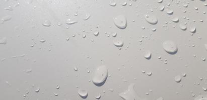 Water droplets perspective through white color surface photo