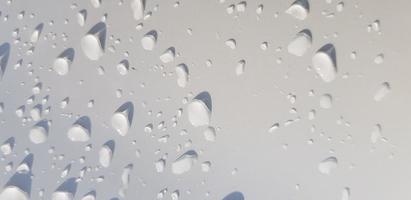 Water droplets perspective through white color surface photo