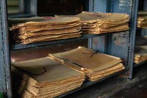 Very old books sitting on the shelves in the library. Books as a symbol of knowledge. photo