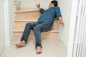 Asian lady woman patient fall down the stairs because slippery surfaces photo