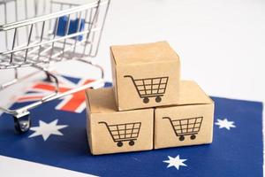 Box with shopping cart logo and Australia flag, Import Export Shopping online or eCommerce finance delivery service store product shipping, trade, supplier concept. photo