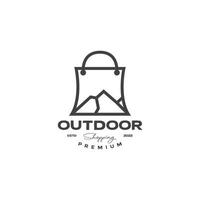 shopping bag with mountain peak outdoor logo design vector