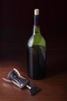 cork screw and a wine bottle photo