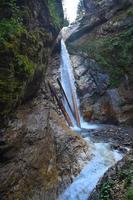 Waterfall with a small stream in the mountains in Austria. A famous ravine called Raggaschlucht photo