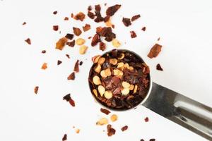 Red Pepper Flakes Spilled from a Teaspoon photo