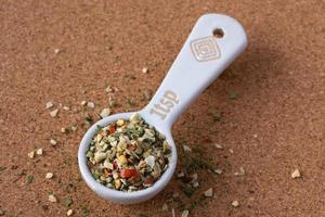 Pizza Seasoning Blend Spilled from a Teaspoon photo