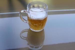 In a glass of fresh and cold beer. photo