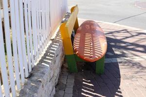 Bench for rest in a city park in Israel. photo