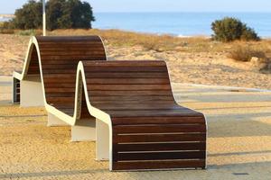 Bench for rest in a city park in Israel. photo