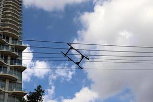 Wires on a pole carrying high voltage electric current. photo