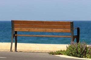 Bench for rest in a city park in Israel. photo
