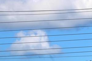 Wires on a pole carrying high voltage electric current. photo