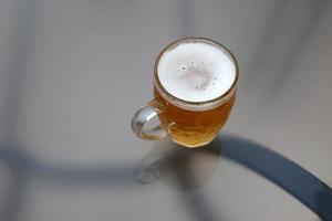 In a glass of fresh and cold beer. photo