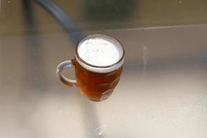 In a glass of fresh and cold beer. photo