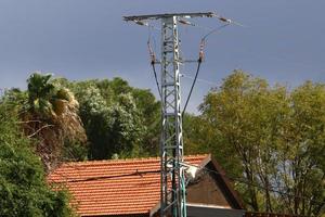 Wires on a pole carrying high voltage electric current. photo