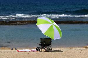 Umbrella in the city park near the sea. photo