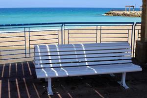 Bench for rest in a city park in Israel. photo