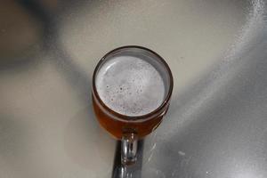 In a glass of fresh and cold beer. photo