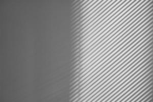 Shadow of window blinds abstract idea for intro or background. Shade from the blinds on the wall of the office photo