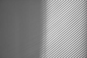 Shadow of window blinds abstract idea for intro or background. Shade from the blinds on the wall of the office photo