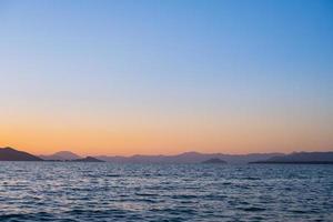 Sunset over the bay, bay in Fethiye, Turkish mediterranean coast, idea for background or advertising photo