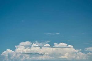 Blue summer sky background with cumulus clouds, idea for screensaver or wallpaper for screen or advertisement, free space for text photo