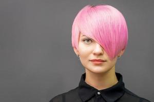 Woman with short bright pink hair photo