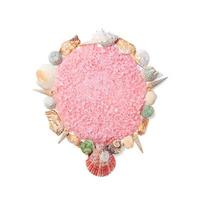 Pink sea salt with shells in the form of a circle. Isolated. Copy space photo