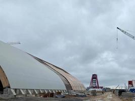 Industrial production of reinforced concrete products. Cranes and equipment on the construction site photo