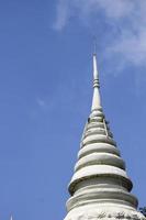 Wat Phnom in the city of Phnom Penh in Cambodia with a blue sky photo