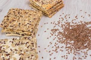 Flax biscuit. Healthy snacks, flaxseed pumpkin seeds, coriander, sunflower seeds. Salted diets are crispy crackers. photo