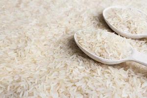 close up of white rice cereal and wooden spoon photo