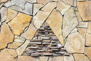 pattern gray color of modern style design decorative uneven cracked real stone wall surface with cement photo