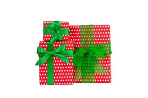 Set of Christmas or other holiday handmade present in red paper with Green ribbon. Isolated on white background, top view. thanksgiving Gift box concept photo