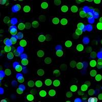 Unfocused abstract colourful bokeh on black background. defocused and blurred many round light photo