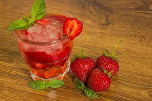 Strawberry iced drink in a wooden table photo