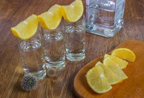 Tequila shot with lime, selective focus photo