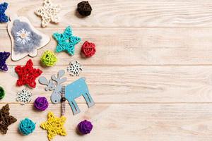 Top view of Christmas decorations and toys on wooden background. Copy space. Empty place for your design. New Year concept photo