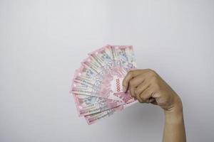 un retrato de nuevos billetes por rp.100,000 emitidos en 2022. moneda rupia indonesia foto