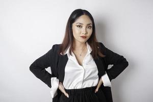 Young Asian business woman in black suit feeling serious and focus staring at camera photo