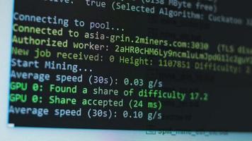 Cryptocurrency mining on a computer screen. The algorithm of the computer program on the monitor. Execution of the program code for the mining program. Pop-up lines of a computer program. video