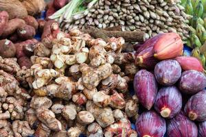 Fresh tropical spices, vegetables and fruits on street market. Local morning market in Luang Prabang, Laos. photo