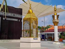 Replica of the Kaaba Golden Lantern, in Taman Madiun Indonesia, sunny weather. photo