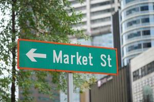 Market street sign and buildings in singapore photo