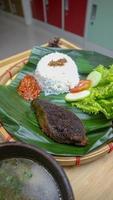 spleen food on a banana leaf with a classic and traditional theme photo