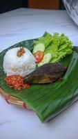 spleen food on a banana leaf with a classic and traditional theme photo